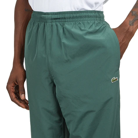 Lacoste guppy track shop pants